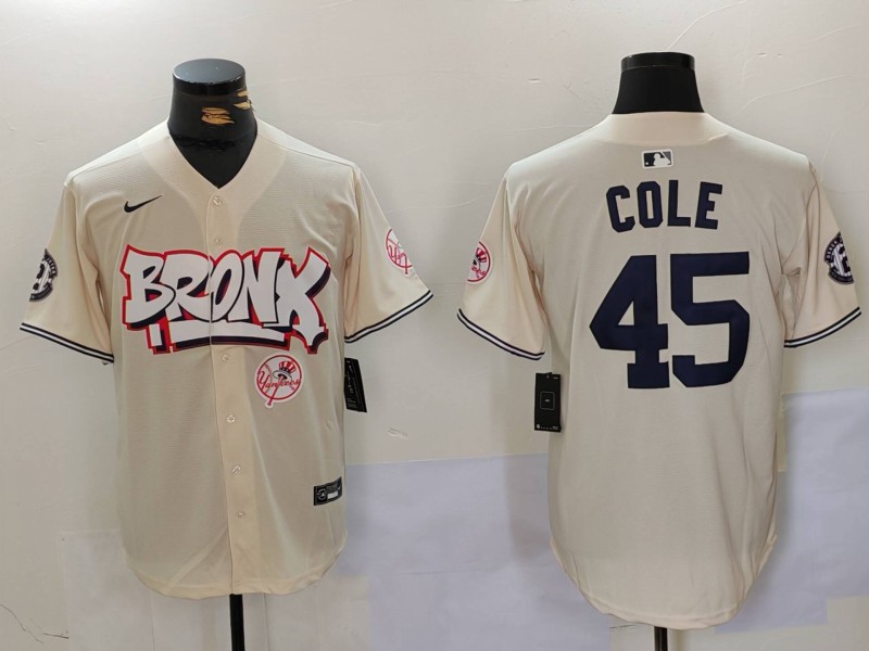 Men's New York Yankees #45 Gerrit ColeCream The Bronx Graffiti V2 Vapor Limited Stitched Baseball Jersey Men's New York Yankees #45 Gerrit ColeCream The Bronx Graffiti V2 Vapor Limited Stitched Baseball Jersey